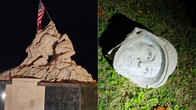 The Iwo Jima statue near Quantico at night, and the head broken off one of its Marine figures