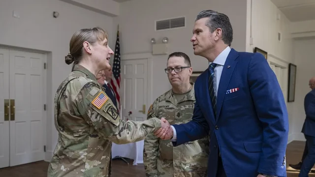 Pete Hegseth shakes hands with a service member at the U.S. Army War College.
